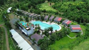 an aerial view of a resort with a swimming pool at Hidden Leaf Resort in Phumĭ Prâmaôy