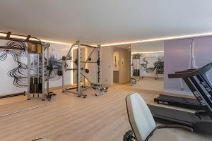 Fitnesscentret og/eller fitnessfaciliteterne på Flat pé na areia c/ vista mar Branco Haus - MyFlats
