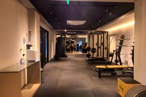 a gym with treadmills and exercise equipment in a room at Flat à beira-mar Beach Haus - MyFlats Hospedagens in Tambaú