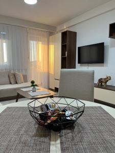 a living room with a bowl on a table at Gabi's Cozy Corner in Kumanovo