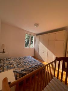 a bedroom with a bed and a window at Apartman Herceg Novi in Herceg-Novi +9 photos