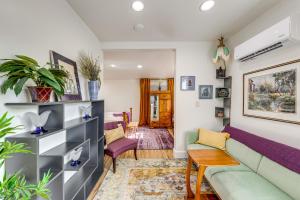 a living room with a couch and a table at Walk to Beach Historic Downtown Anacortes Studio in Anacortes