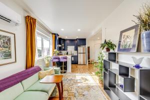 a living room with a couch and a table at Walk to Beach Historic Downtown Anacortes Studio in Anacortes