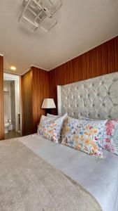 Ένα ή περισσότερα κρεβάτια σε δωμάτιο στο Amy Apartment frente al metro Irarrazaval