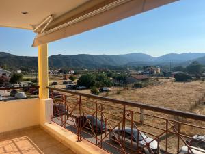 a balcony with a view of the mountains at Hotel Kosmas in Sarti
