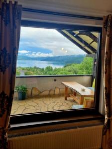 a view from a window of a balcony with a table at Casa David in Gura Hangului