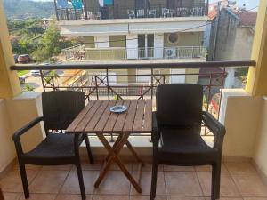 a table and chairs on a balcony with a view at Hotel Kosmas in Sarti