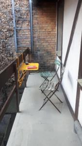 a table and a chair sitting on a patio at Kranich in Ueckermünde +2 photos