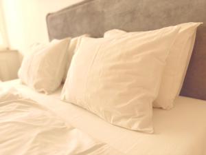 Posteľ alebo postele v izbe v ubytovaní Trio Apartments