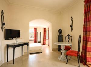 a living room with a couch and a table at Palazzo Gattini - The Leading Hotels of the World in Matera