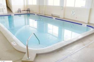 a large swimming pool in a building at Stylish Studio Ocean View in Daytona Beach