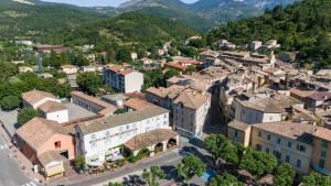 an aerial view of a town in the mountains at Hotel du Levant in Castellane