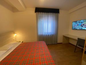 Postel nebo postele na pokoji v ubytování Hotel International