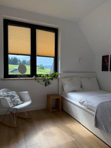 Posteľ alebo postele v izbe v ubytovaní ApartSki 18d