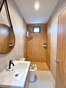 a bathroom with a sink and a toilet and a shower at Home 2 bedroom Rayong long stay Phala Beach in Ban Chang +33 photos