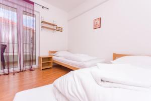 Posteľ alebo postele v izbe v ubytovaní Apartment Horizont