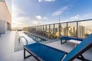 a balcony with a view of a city at Yume On Paulista in São Paulo +63 photos