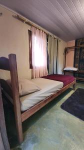 Postel nebo postele na pokoji v ubytování Jungla Hostel