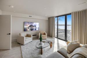 a living room with a couch and a table at Lakeview House by Leavetown Vacations in Lakefield