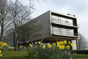 a building with yellow flowers in front of it at Waddell Hall, University of Cumbria in Lancaster +2 photos