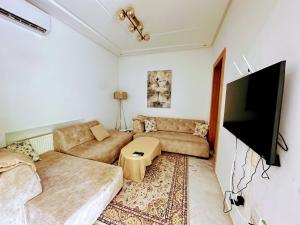 TV a/nebo společenská místnost v ubytování Dar Julia + 3 fotografie