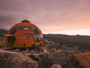 a dome building on top of a mountain at DomoChango in La Serena