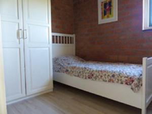 Ένα ή περισσότερα κρεβάτια σε δωμάτιο στο Ferienhaus-Naumann-Kreetz