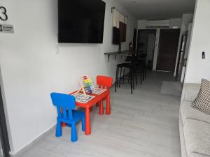 a table with two chairs and a table with a book on it at 3 Bed 2 Bath Family House w Private Pool Dorado del Mar in Dorado +54 photos