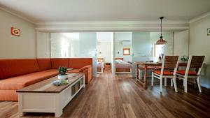 a living room with a couch and a table at Holiday Home Virida, app Leopold III in Ivančna Gorica