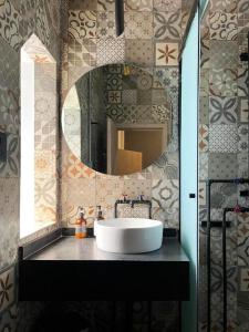 a bathroom with a sink and a mirror at Eonia in Atlixco +84 photos