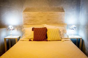 Cama ou camas em um quarto em Pousada Hospedaria215