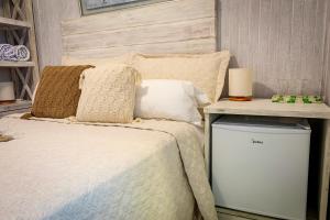 Cama ou camas em um quarto em Pousada Hospedaria215