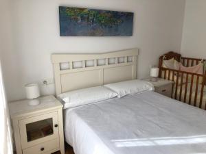 En eller flere senge i et værelse på Apartamento muy acogedor , en el casco antiguo.