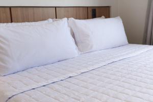 Ένα ή περισσότερα κρεβάτια σε δωμάτιο στο Hotel Caminhos da Oiticica