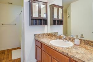 a bathroom with a sink and a mirror at Tavares Retreat with Covered Patio and Private Yard in Tavares +17 photos
