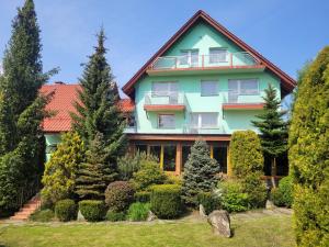 a large house with a garden in front of it at Ośrodek wypoczynkowy Wierchy in Laliki +80 photos