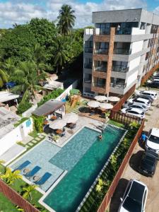 an overhead view of the pool at the resort at Maré Alta Beach Hall by AFT in Tamandaré