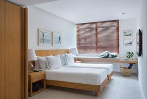 Кровать или кровати в номере JANEIRO Hotel