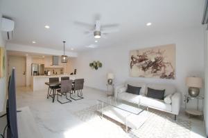 a living room with a couch and a table at AMATERRA modernos aptos cerca a la playa in Cabo San Lucas