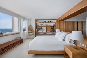 Кровать или кровати в номере JANEIRO Hotel +37 фотографий