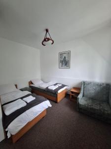 Postel nebo postele na pokoji v ubytování Ośrodek Edukacji Leśnej LEŚNIK w Zakopanem