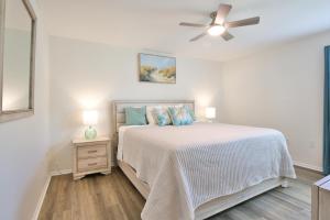 a white bedroom with a bed and a ceiling fan at Florida Vibes in Bradenton +35 photos