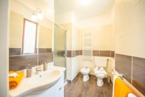 a bathroom with a sink and a toilet at Nonna Arde in Beverino +36 photos
