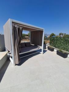 a gazebo on the roof of a house at סוויטת בארי , שלווה בגליל העליון in Mishmār Hāyardin