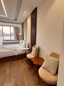 Ein Bett oder Betten in einem Zimmer der Unterkunft Ra Palace Pyramids View Hotel