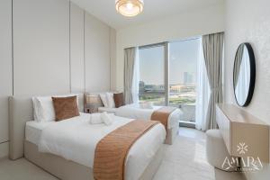 Ένα ή περισσότερα κρεβάτια σε δωμάτιο στο Grande Luxury, Burj Khalifa & Fountain View +45 φωτογραφίες