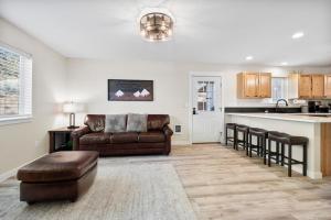 a living room with a couch and a kitchen at Tumalo Ranch home in Tumalo