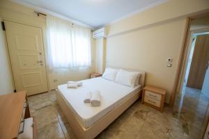 Postel nebo postele na pokoji v ubytování Schinias Paradise + 59 fotografií