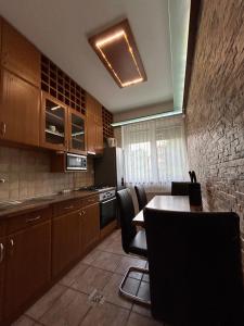 Kuchyň nebo kuchyňský kout v ubytování Angéla Apartman
