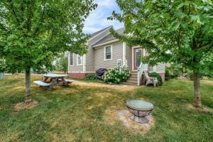 a house with a picnic table in the yard at The Pronghorn - 97 Butternut in Cherry Valley
